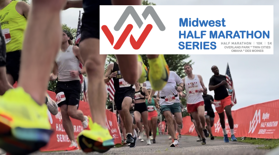 Runners participating in the Midwest Half Marathon Series, with feet in motion on a course lined by red banners. The event sign is displayed prominently in the scene.